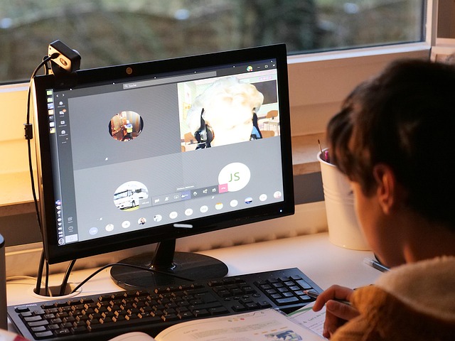 student using laptop for English learning online in Canada